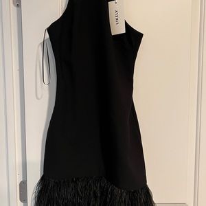 Black cocktail dress with feather hem detail